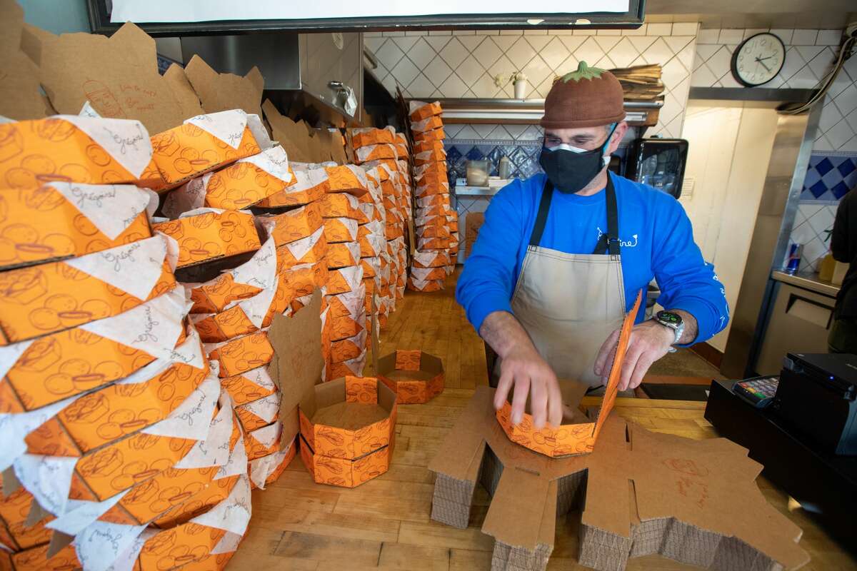 Owner and chef Grégoire Jacquet assembles one of his patented takeout boxes at Grégoire take-out restaurant in Berkeley, Calif. on Jan. 12, 2022.