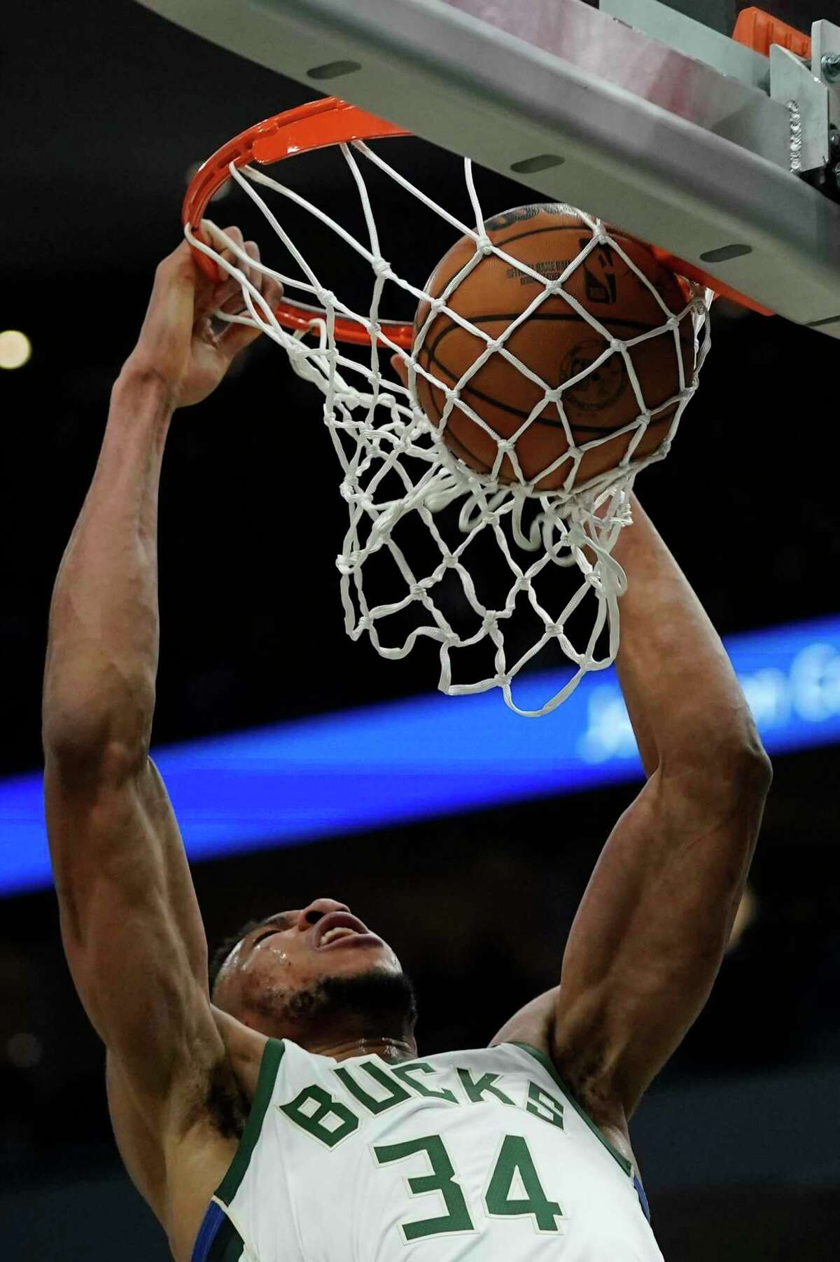 Milwaukee Bucks' Giannis Antetokounmpo dunks during the second half of an NBA basketball game against the Golden State Warriors Thursday, Jan. 13, 2022, in Milwaukee. (AP Photo/Morry Gash)