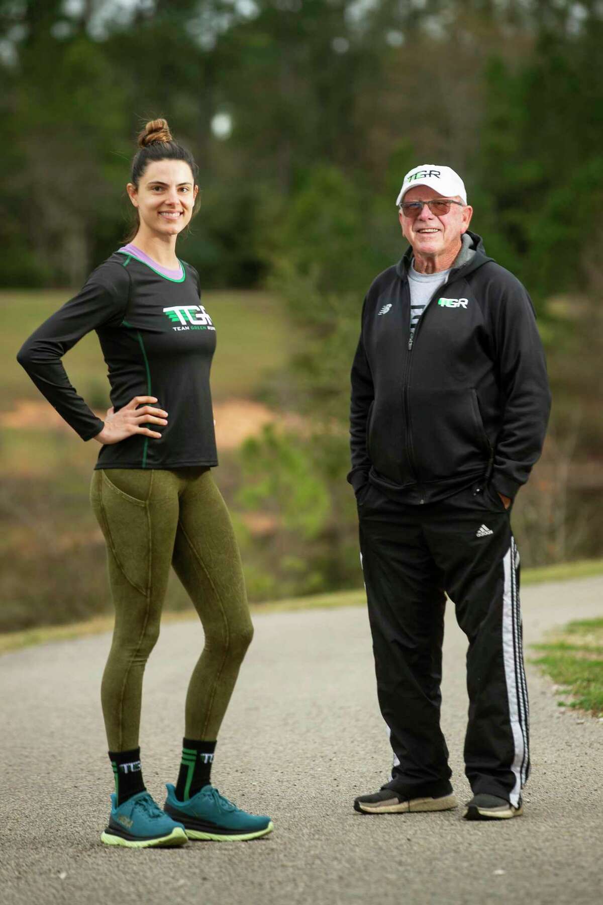First-time marathon runner Tiffany Moran, left, and her coach Dan Green pose for a portrait before a training session Wednesday, Jan. 12, 2022 in The Woodlands. Green, who was the first winner of the Houston Marathon in 1972 and long-time track and cross country coach at McCullough and The Woodlands High School, now coaches runners from all different skill levels through Team Green Running.