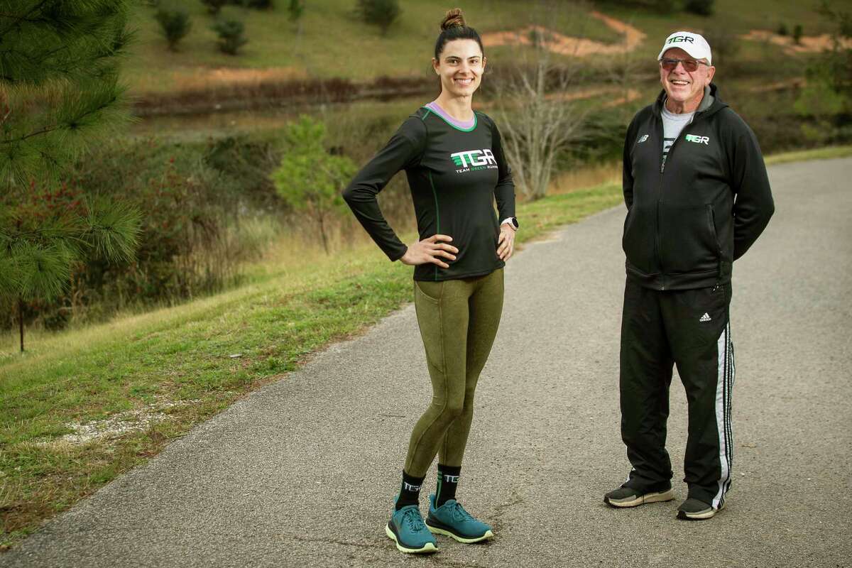 First-time marathon runner Tiffany Moran, left, and her coach Dan Green pose for a portrait before a training session Wednesday, Jan. 12, 2022 in The Woodlands. Green, who was the first winner of the Houston Marathon in 1972 and long-time track and cross country coach at McCullough and The Woodlands High School, now coaches runners from all different skill levels through Team Green Running.