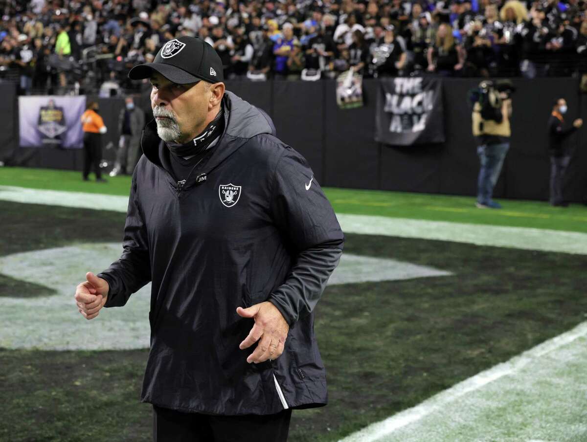 Interim head coach Rich Bisaccia of the Las Vegas Raiders runs onto the field for a game against the Los Angeles Chargers on Sunday.
