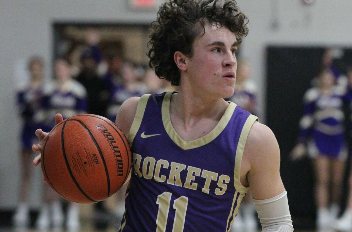 Routt's Nolan Turner looks over the defense during a boys' basketball game against Liberty in the semifinals of the Winchester Invitational Tournament Thursday night.