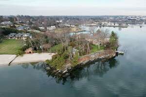 The Belle Haven neighborhood of Greenwich, Conn., photographed from Greenwich Harbor on Thursday, Jan. 13, 2022. At the end of 2021, house price sales topped $3 million in the town.