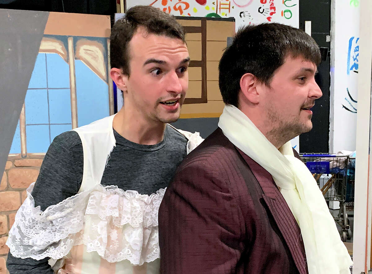 Bryan Buzbee, left, and Chaz Romero rehearse a scene from Beaumont Community Playerâs âPride and Prejudice.â Photo by Andy coughlan