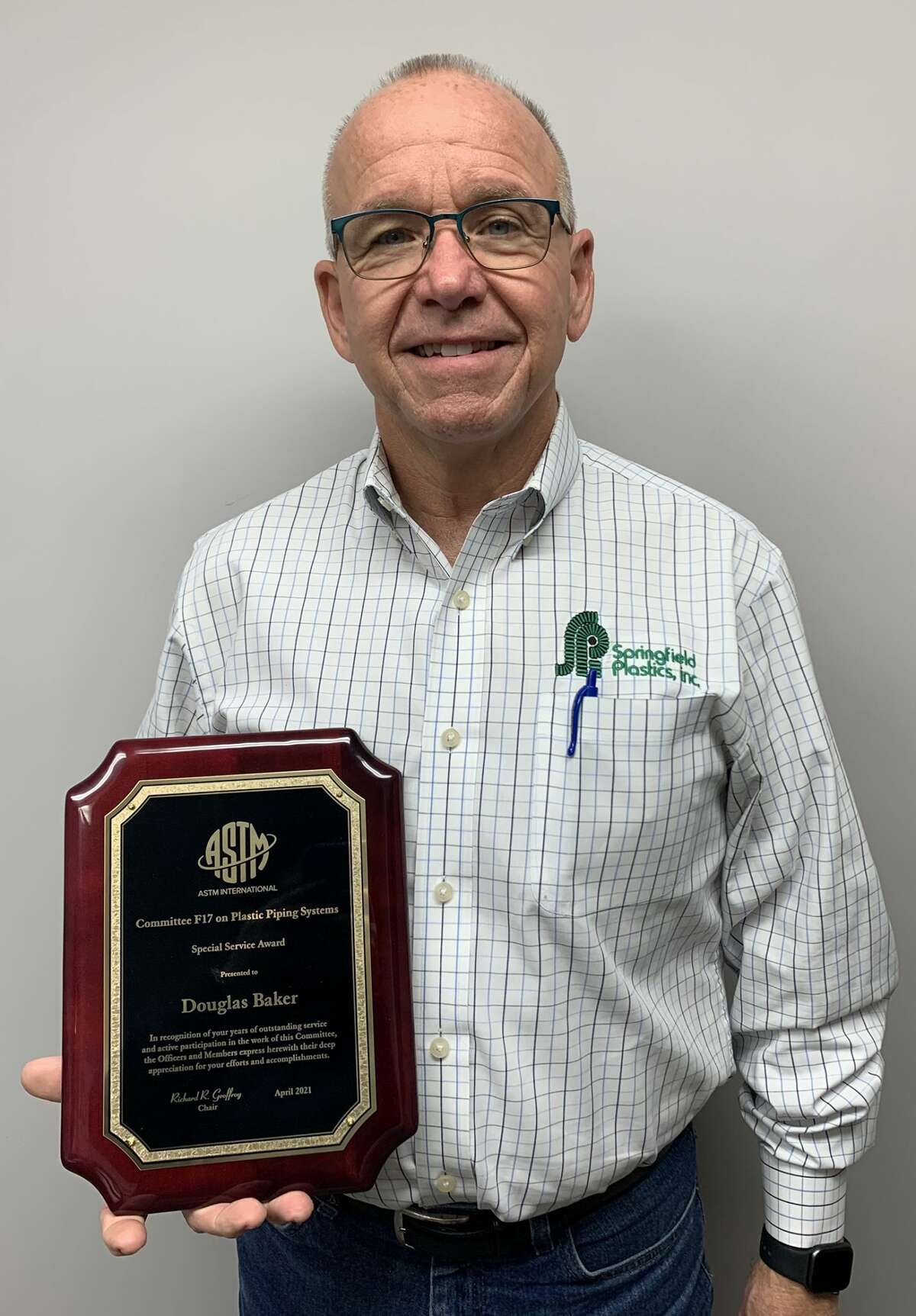 Doug Baker has been honored for his work in improving standards in the plastic piping systems industry.