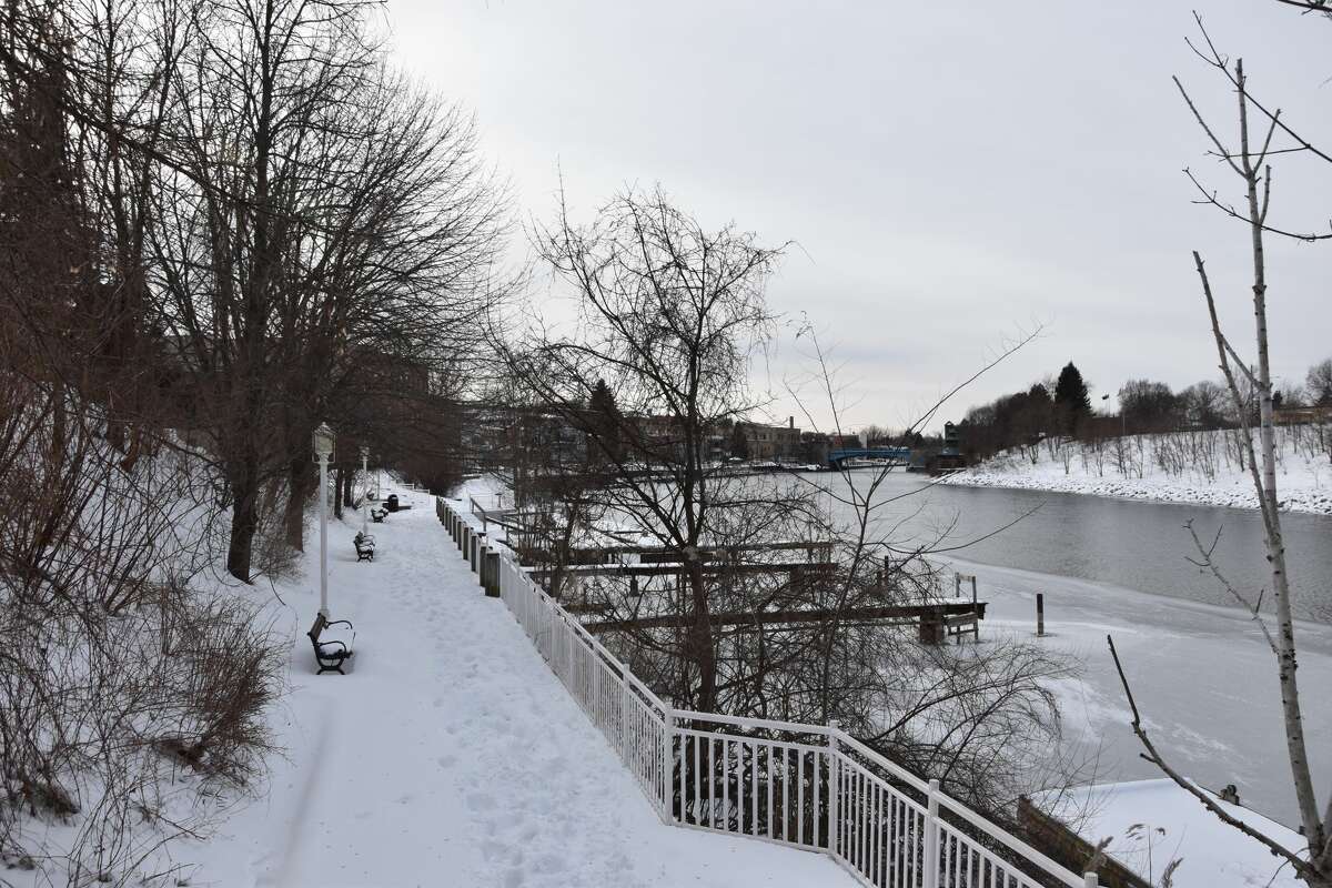 The Manistee Riverwalk looked calm, but docks and lakeshore could be seen icing over on Friday. 