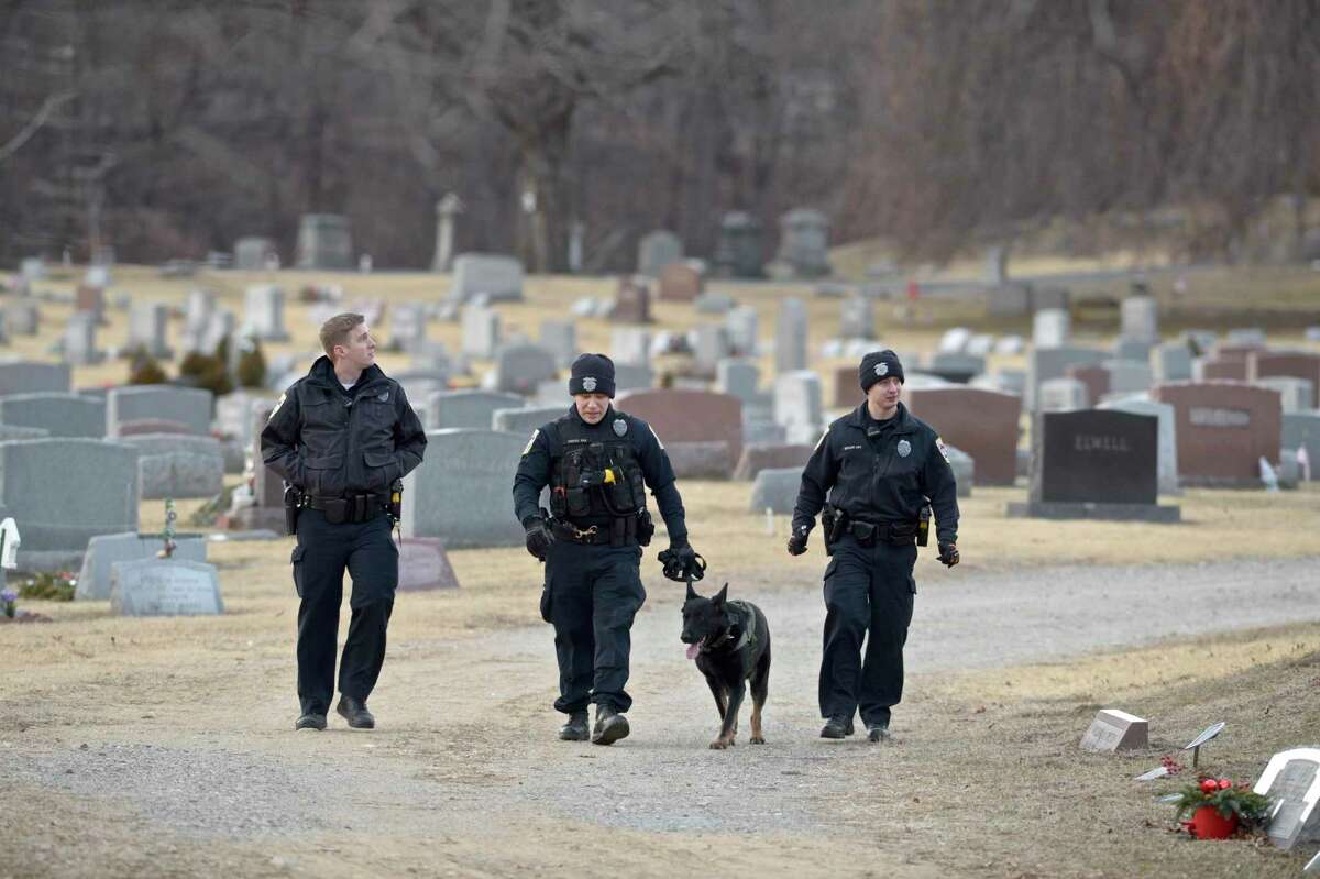 Police and fire departments in the Danbury area have faced staffing shortages due to COVID-19 infections. In this file photo, police officers search Wooster Cemetery near Danbury Hospital after a shooting on Thursday afternoon. January 17, 2019, in Danbury, Conn.