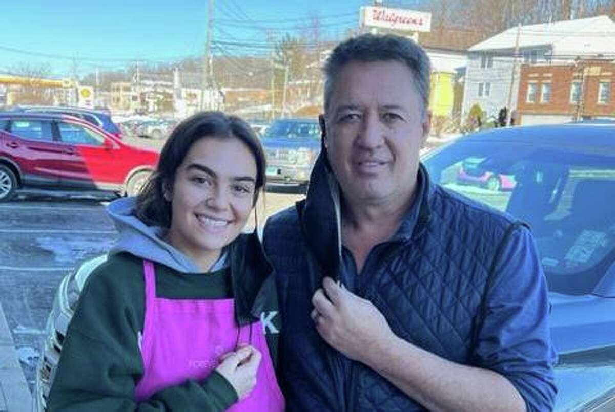 Norwalk’s Ron Darling, a former MLB pitcher, poses with Victoria Robledo (left) at Forever Sweet Bakery in Norwalk on Jan. 8, 2022. Darling stopped by to pick up a cake at the bakery, where Robledo is the customer service representative.