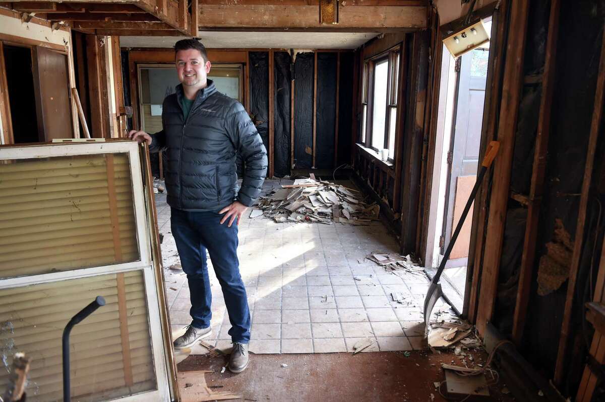 Jonathan Hunt is photographed inside the former Libby's Excuse Room Cafe which is being gutted for his new business, The Grey Goat Farmtique, in Branford on January 12, 2022.