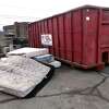 Mattresses next to a dumpster at the Public Works Department on Collis Street in West Haven on Jan. 14, 2022.