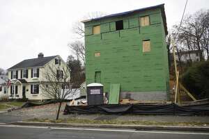 A stop-work order was issued for building a structure that is still under construction that is higher than allowed on Sinawoy Road in Cos Cob.