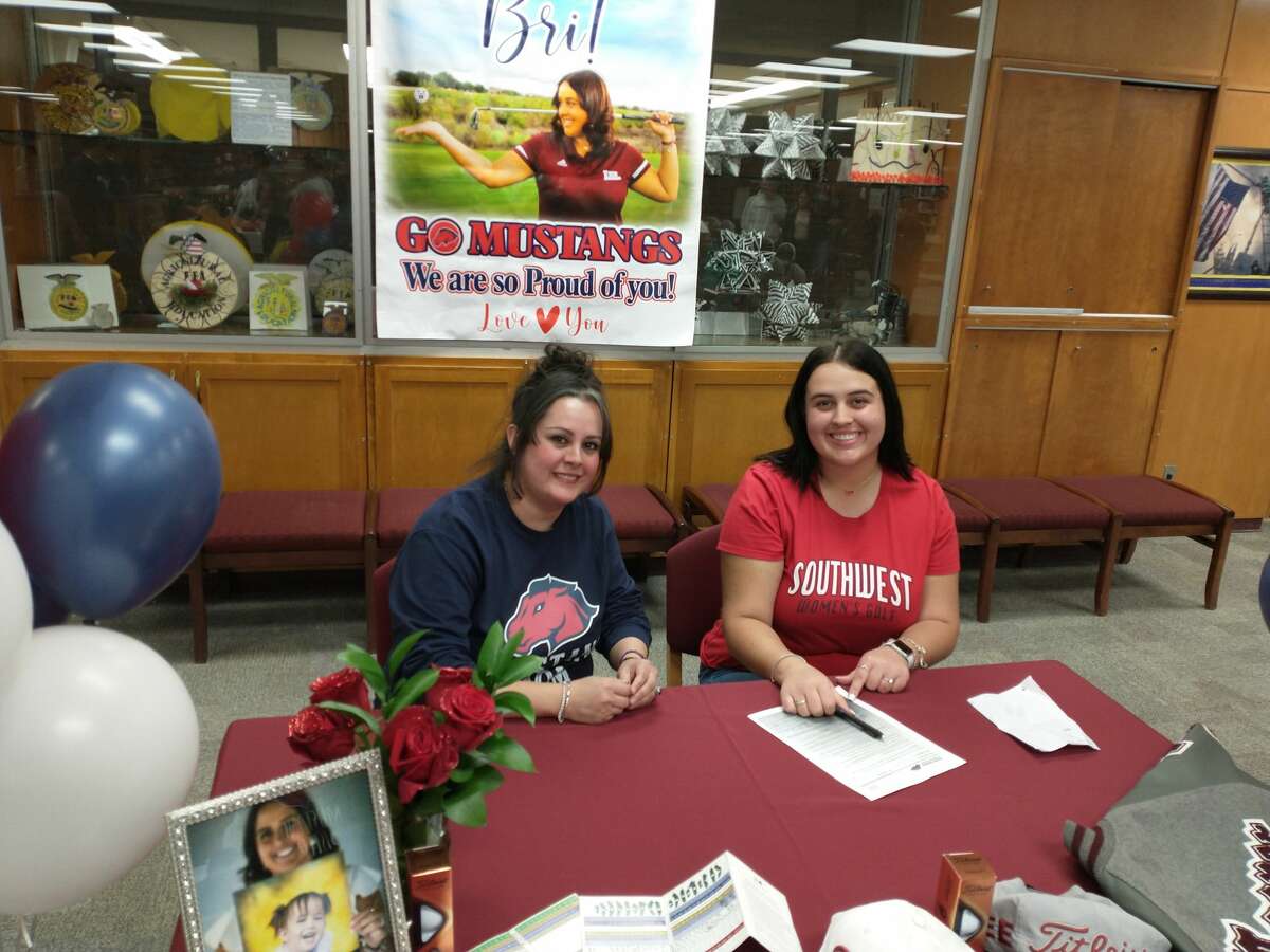 Legacy High School senior Brianna Cooper, right, poses with her mother Christina after she signed to play at the University of the Southwest on 1/14/2022 at the LHS library. 
