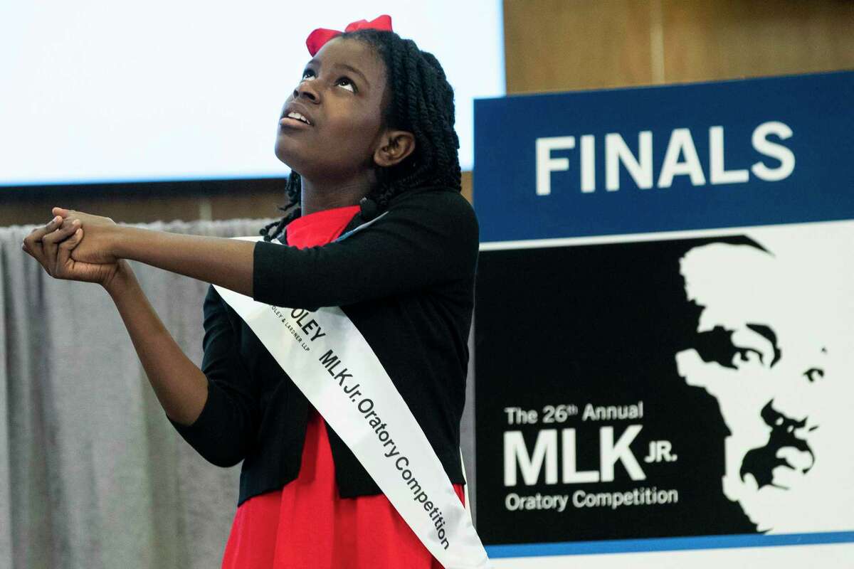 Jada Lee, of Windsor Village Elementary, gives her speech during the annual MLK Oratory Competition Friday, Jan. 14, 2022 in Houston. For more than 20 years, fourth- and fifth-graders from two dozen HISD schools have competed in the annual contest, which challenges students to write and present a short original speech on a subject related to the slain civil rights leader.