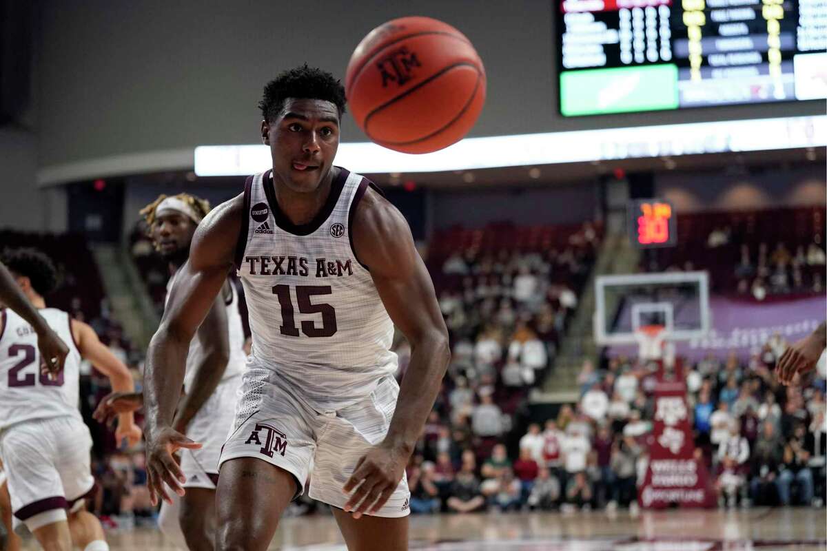 Texas A&M forward Henry Coleman III (15) goes for a loose ball against Mississippi during the first half of an NCAA college basketball game Tuesday, Jan. 11, 2022, in College Station, Texas. (AP Photo/Sam Craft)