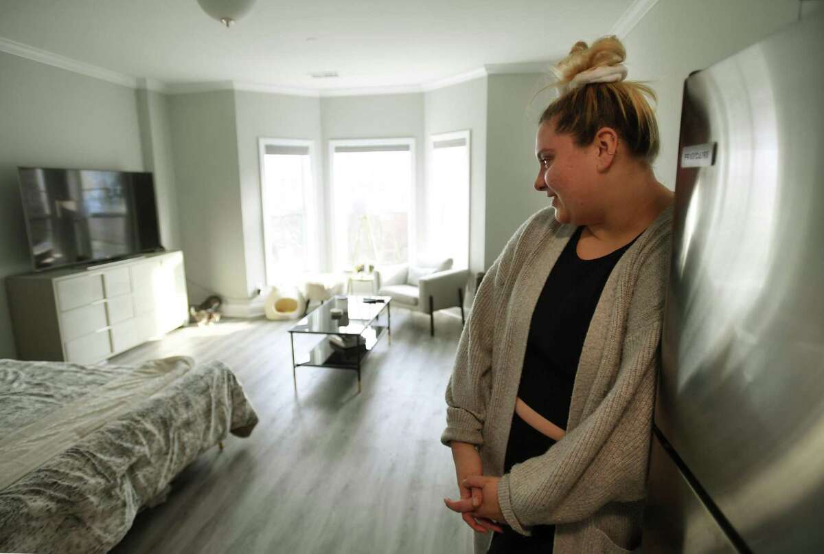 Kaysee Talcic enjoys her studio apartment at Cedar Village 2, one of many recent housing developments in Shelton, Conn. on Friday, January 14, 2021.