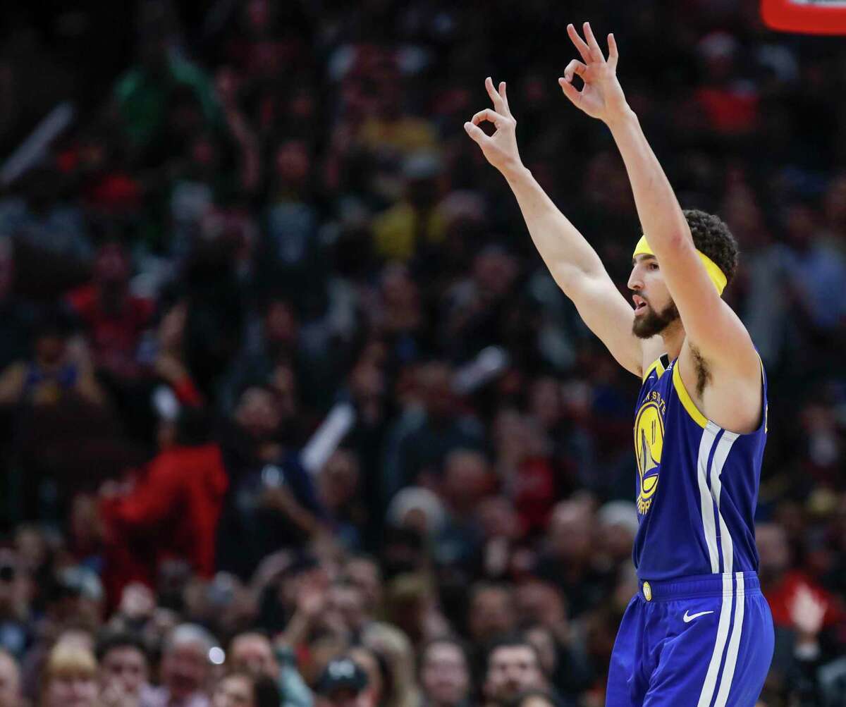 Golden State Warriors guard Klay Thompson celebrates after scoring a three pointer against the Chicago Bulls during the second half of an NBA basketball game, Monday, Oct. 29, 2018, in Chicago. (AP Photo/Kamil Krzaczynski)