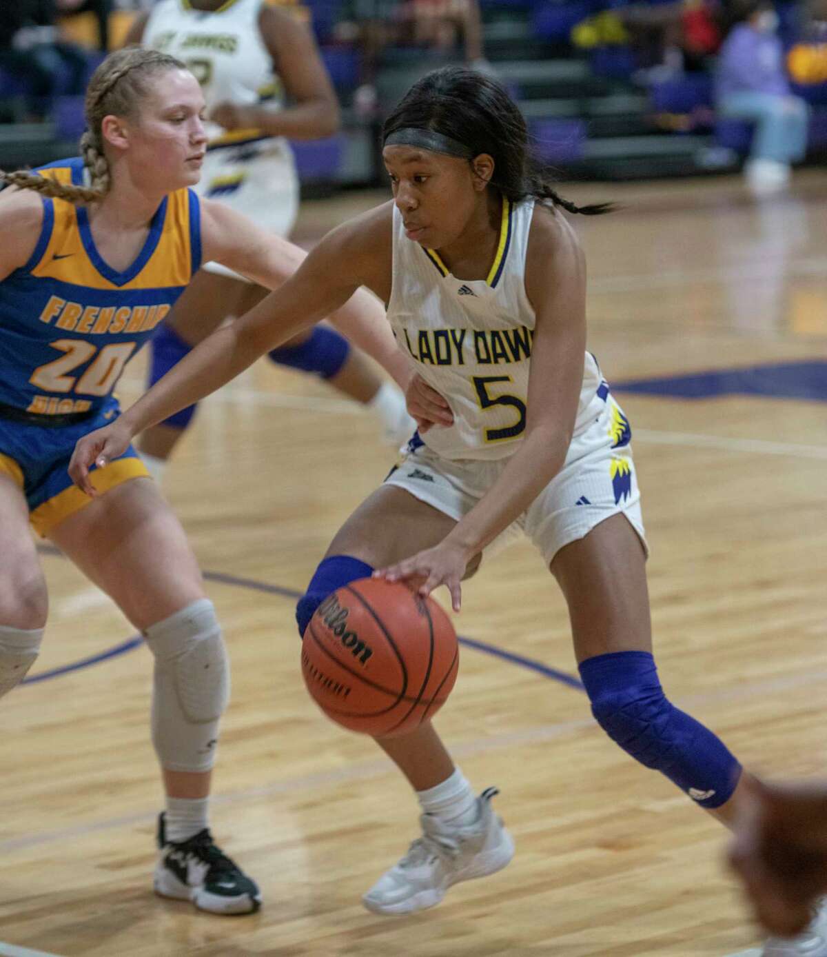 Midland High's Makayla Williams looks to drive inside as Frenship's Chandler Wilson defends 01/14/2022 at the Midland High gym. Tim Fischer/Reporter-Telegram