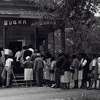 A group of voters line up outside the polling station, a Sugar Shack small store, in Peachtree, Ala. on May 3, 1966, after the Voting Rights Act was passed the previous year. (Photo by MPI/Getty Images)