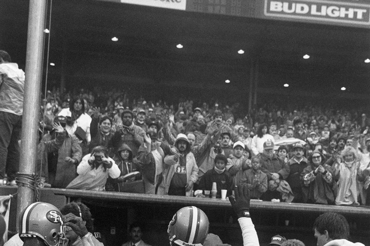 Dwight Clark waves to the crowd after the final game of his career on January 9, 1988.