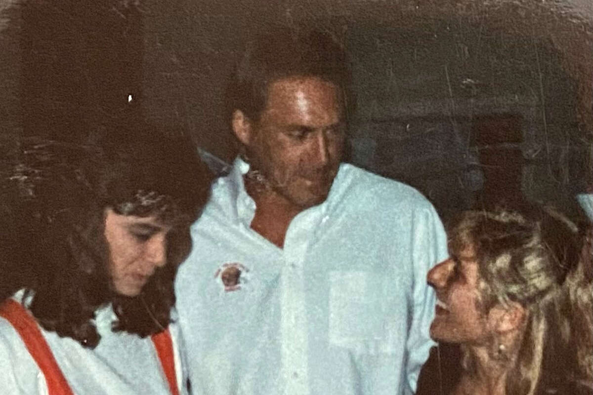 Dwight Clark greets diners at his restaurant, including Kjirsten Tuohy (who was celebrating her 30th birthday) at his Redwood City restaurant.