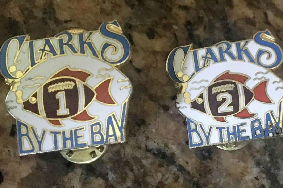 Commemorative pins that were given  to Clark's restaurant workers based on years of service