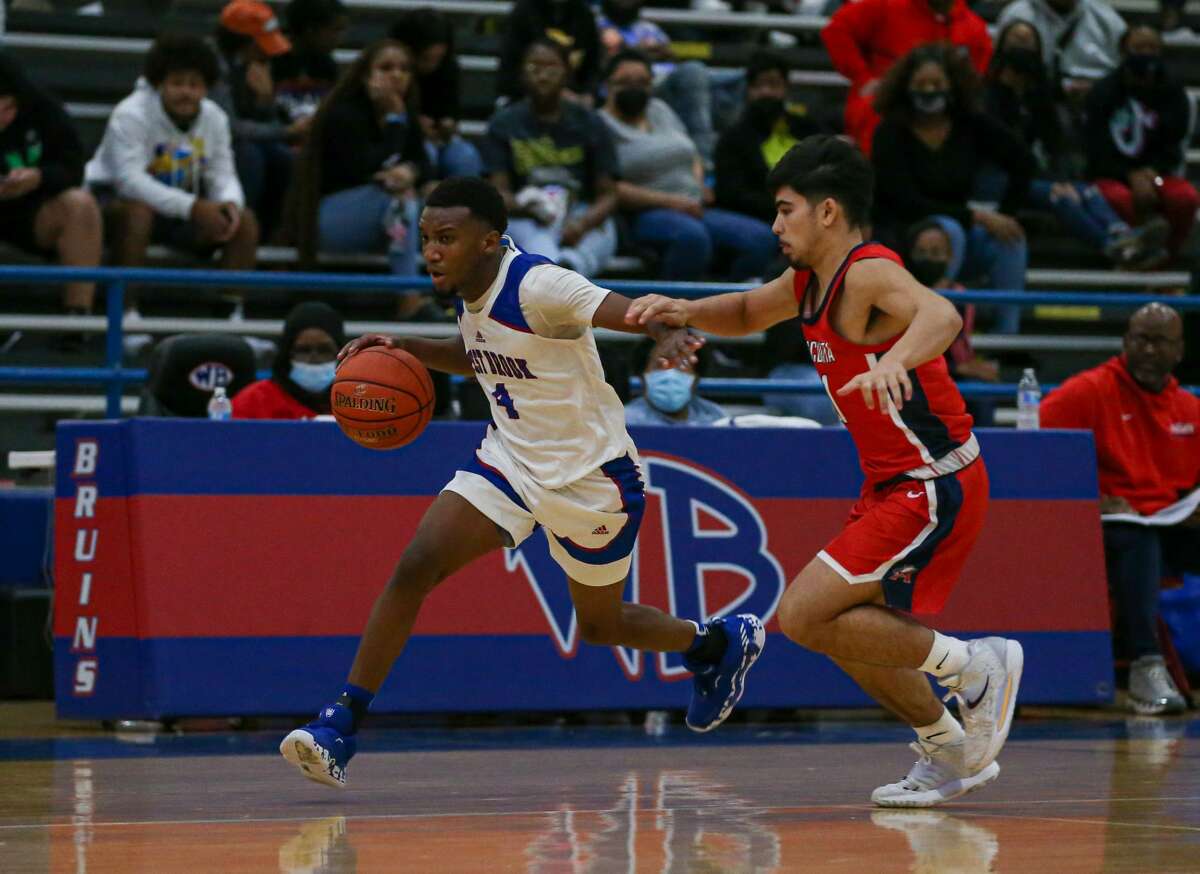 Mason Donald (4) drives down the court against Atascocita Friday night at Westbrook High School in Beaumont, TX. Photo taken January 14, 2022 by Jarrod Brown