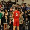 Benzie Central's Nate Childers prepares to shoot a free throw in front of Frankfort's student section. 
