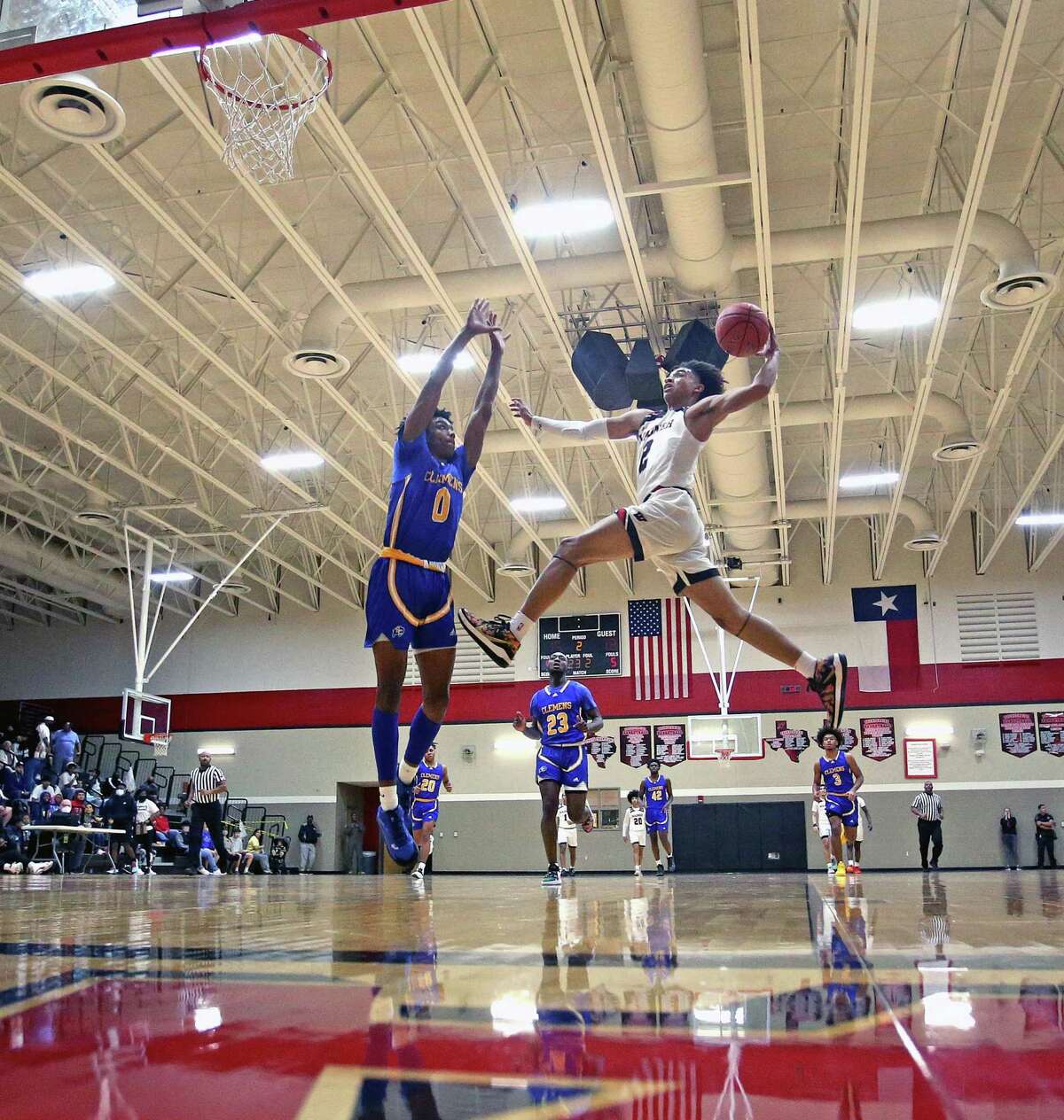 Wagner guard Austin Nunez #2 attempts a dunk over Clemens forward Theo Grant #0, however it was blocked, in the first half on Friday, Jan. 14, 2022 at Wagner HS. Wagner defeated Clemens 61-52