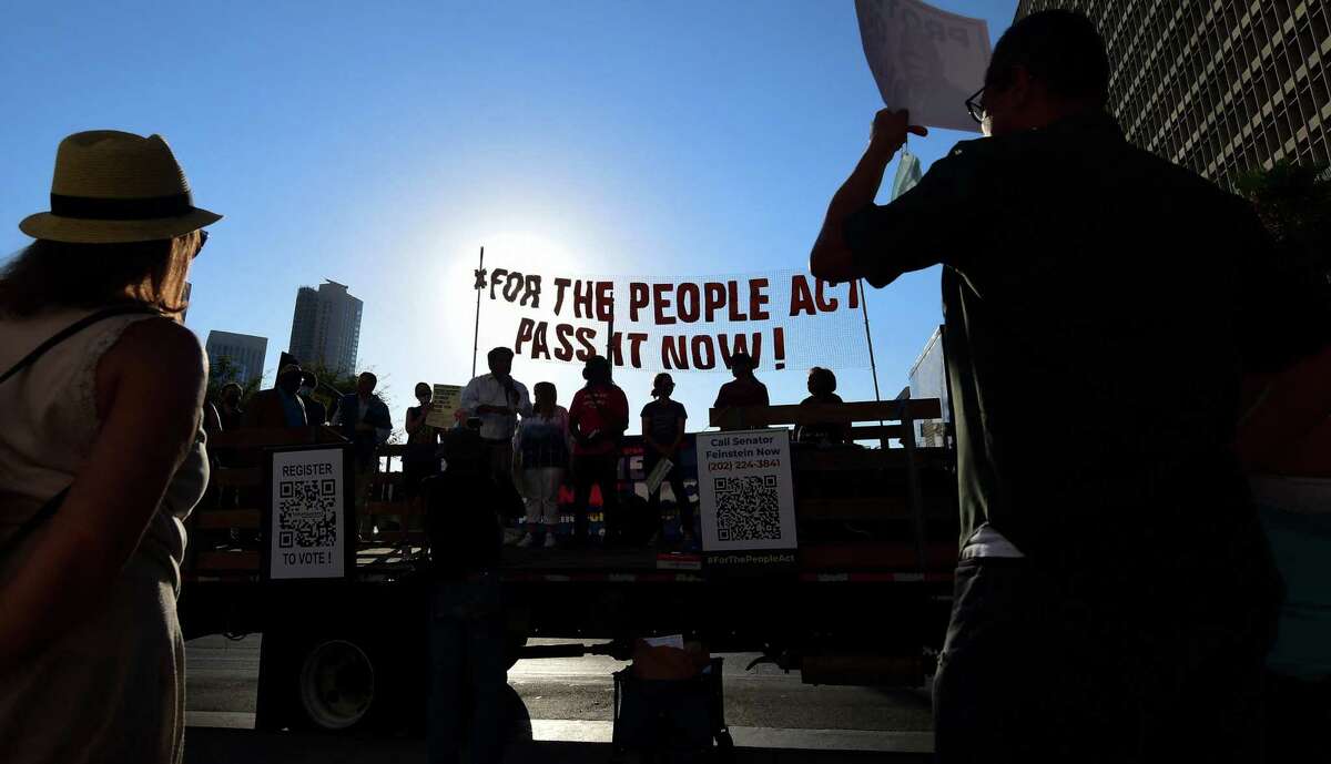 Activists rally outside Los Angeles City Hall in July to call on Congress and Sen. Dianne Feinstein to remove the filibuster and pass the For the People Act to expand voting rights.