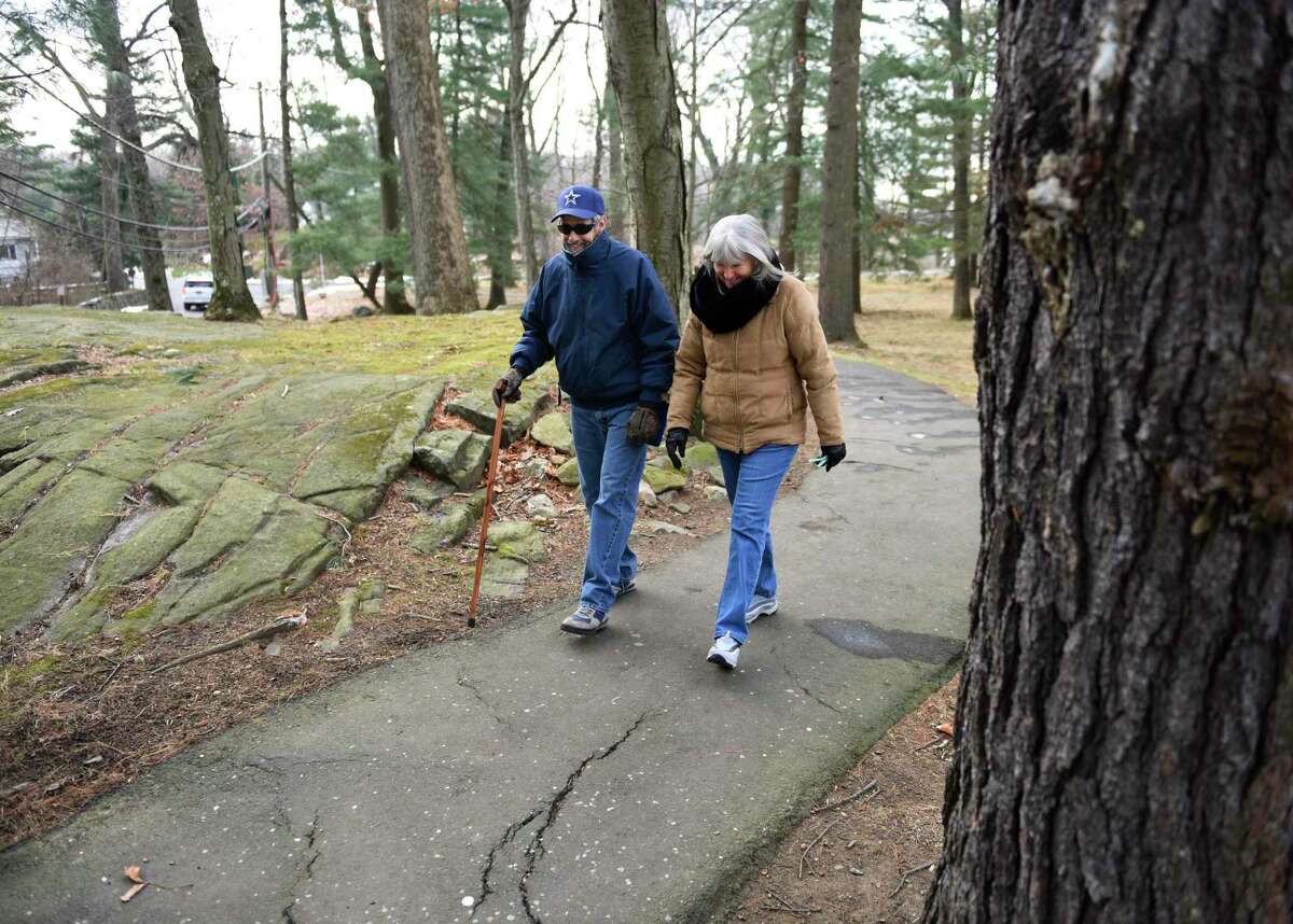 Alexander "Sandy" Natale and Nancy Natale, of Chickahominy, go for a walk at Bruce Park in Greenwich, Conn. Thursday, Jan. 13, 2022. The Greenwich Board of Selectmen is considering designating Bruce Park as a local historic property.