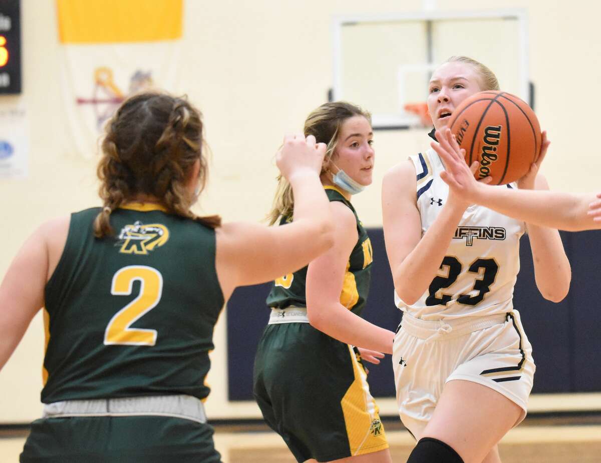Father McGivney's Sami Oller drives to the basket in the second quarter against Metro-East Lutheran on Friday in Glen Carbon.