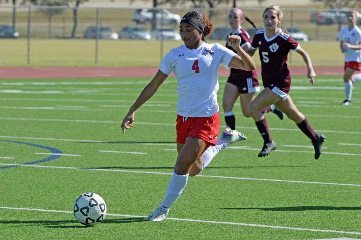 Hillary Griffin (4) of Manvel passes a ball during the first half of a match in the I-10 Shootout between Manvel and Cy Fair Thursday at Cinco Ranch High School.