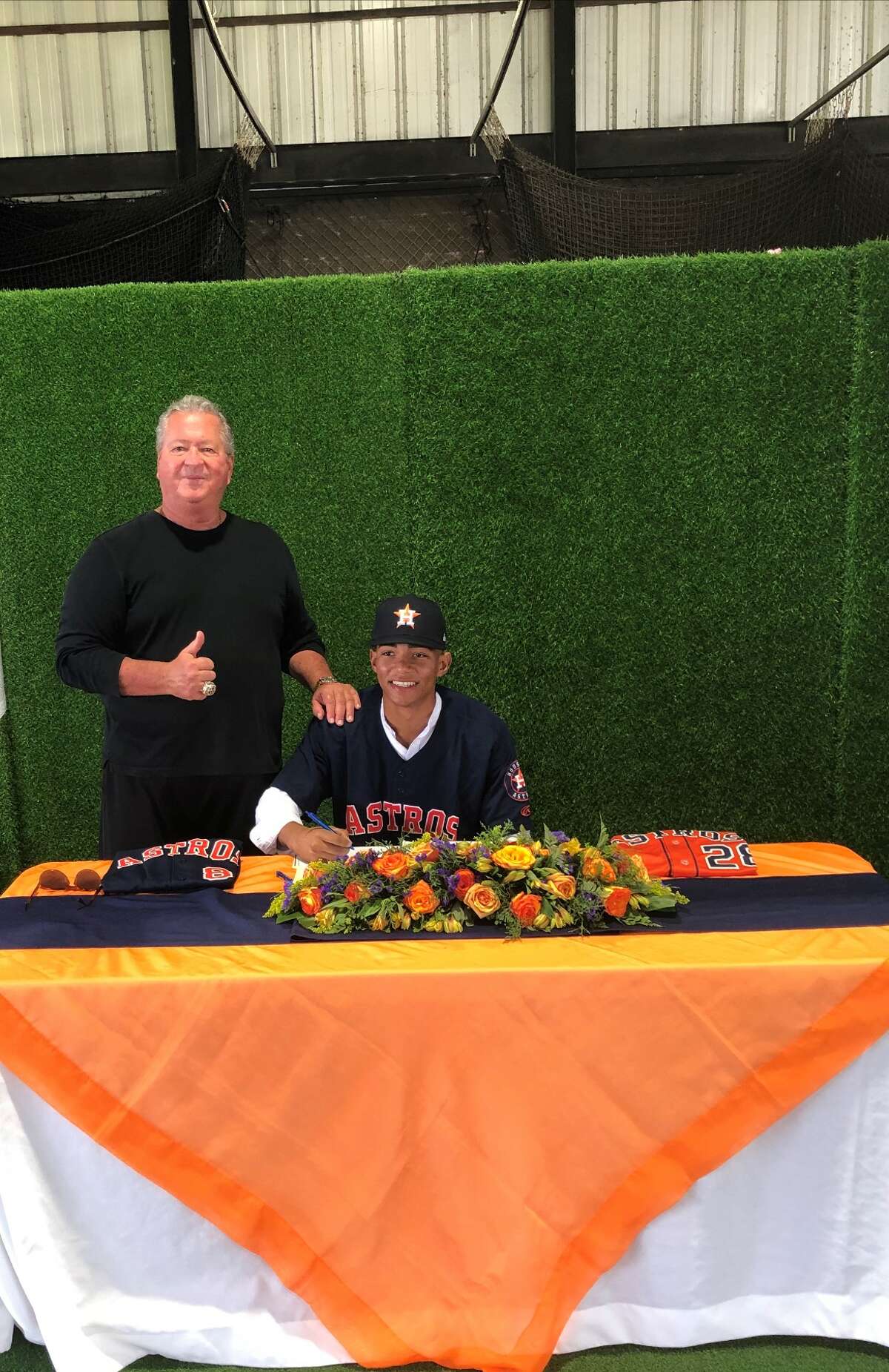 Kenni Gomez pictured with signing scout Charlie Gonzalez