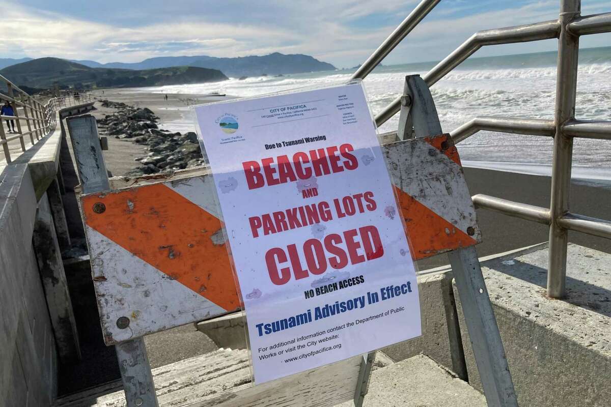 Signs warn of a tsunami near Pacifica Municipal Pier.