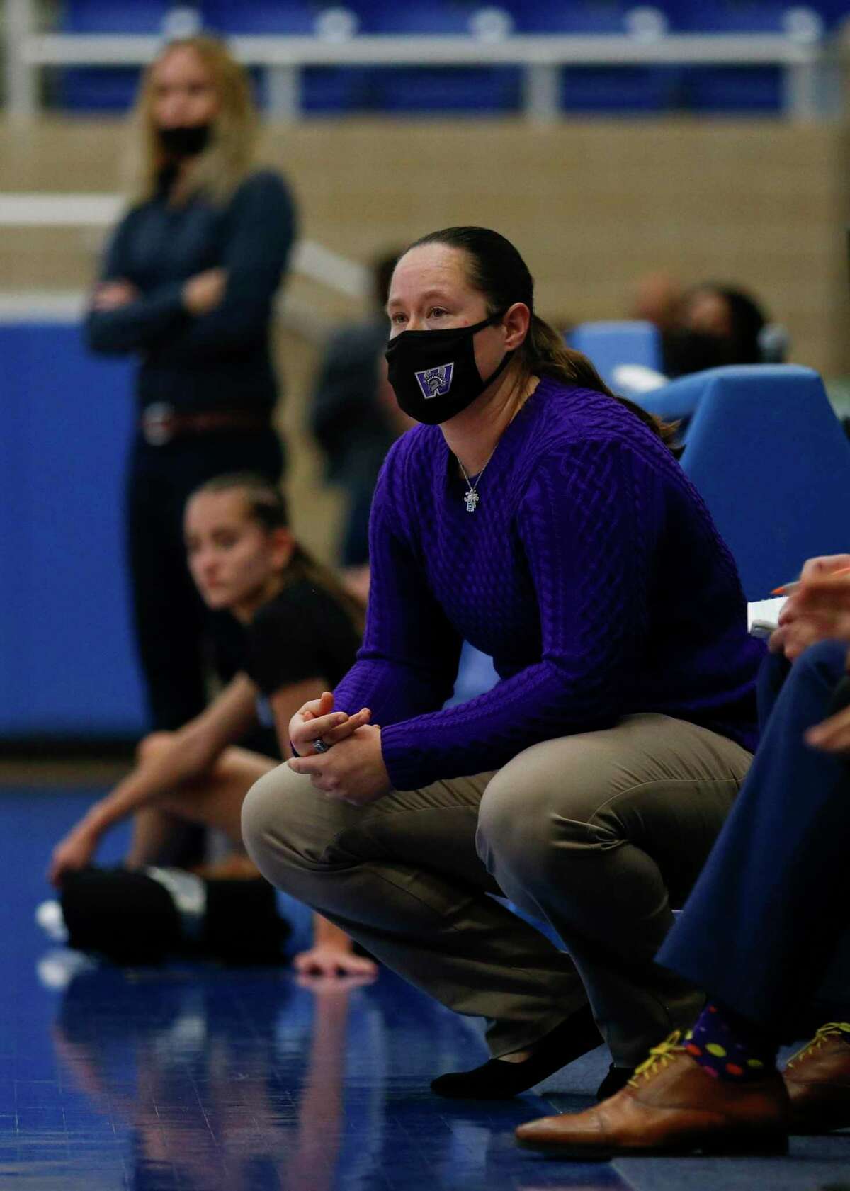 Warren Head Coach Haley Richter watches her team take on the Harlan Hawks in the second quarter a conference game at Northside Gym in San Antonio, Texas, Saturday, Jan. 15, 2022. The Hawks defeated the Warriors 70-37.