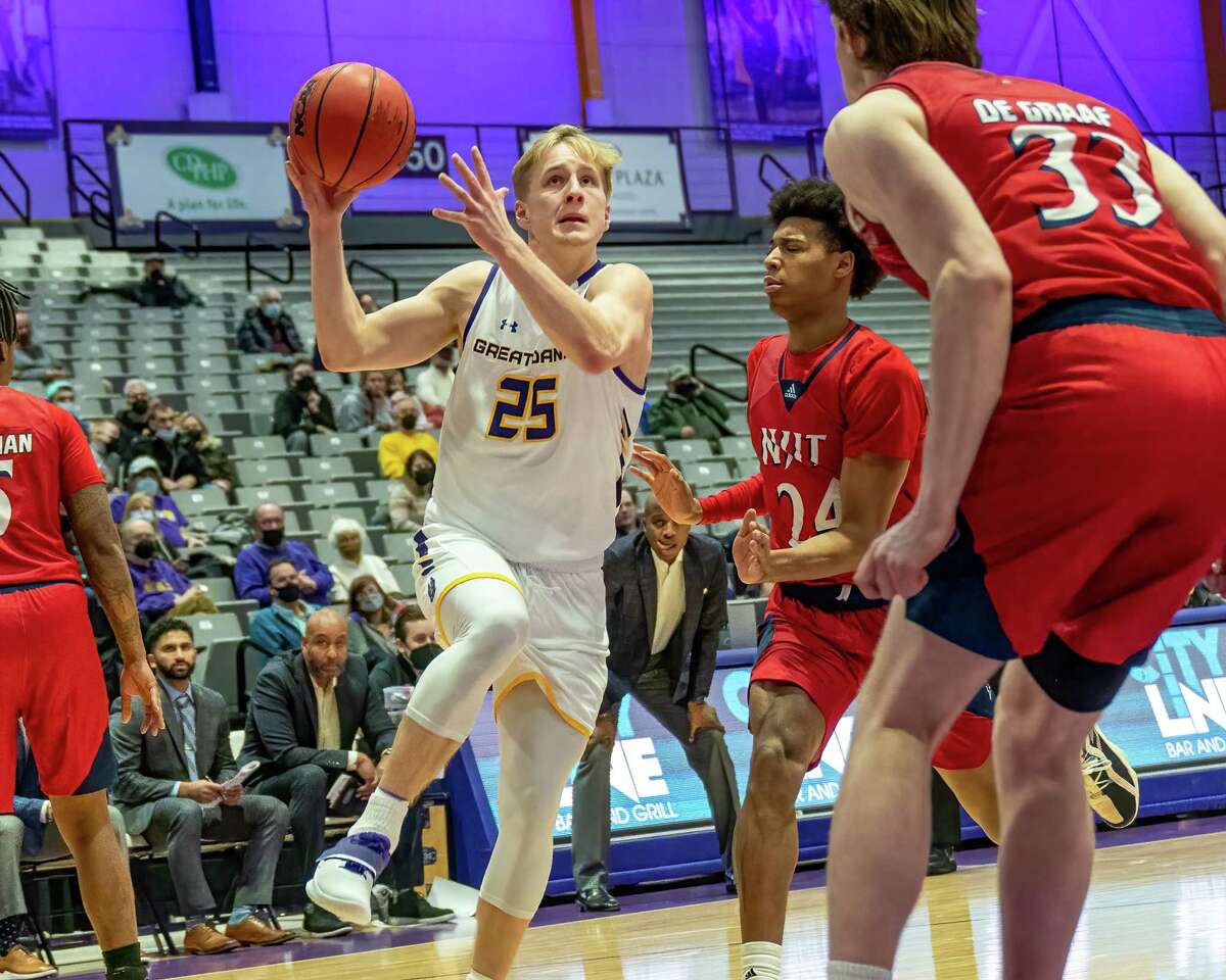 UAlbany sophomore Luke Fizulich drives to the basket in front of two NJIT defenders during an America East game at the SEFCU Arena on the UAlbany Campus on Saturday, Jan. 15, 2022. (Jim Franco/Special to the Times Union)