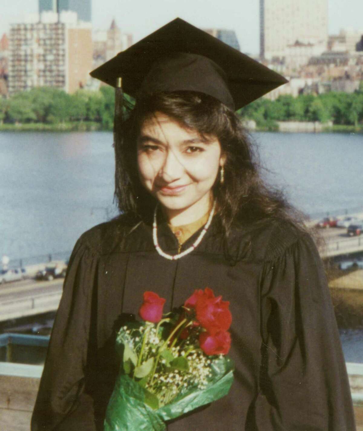 In this undated photo provided by the law firm Whitfield, Sharp and Sharp, Aafia Siddiqui is shown after her graduation from Massachusetts Institute of Technology. Siddiqui, 36, was convicted of multiple felonies. She was arrested outside an Afghan governor's compound, where authorities allege she was carrying bottles and jars of chemicals, papers describing U.S. landmarks, and instructions on how to make chemical weapons. Prosecutors say she was shot by a U.S. Army officer after she grabbed his Army M-4 rifle from the floor and pointed it at an Army captain, crying "Allah Akbar!"