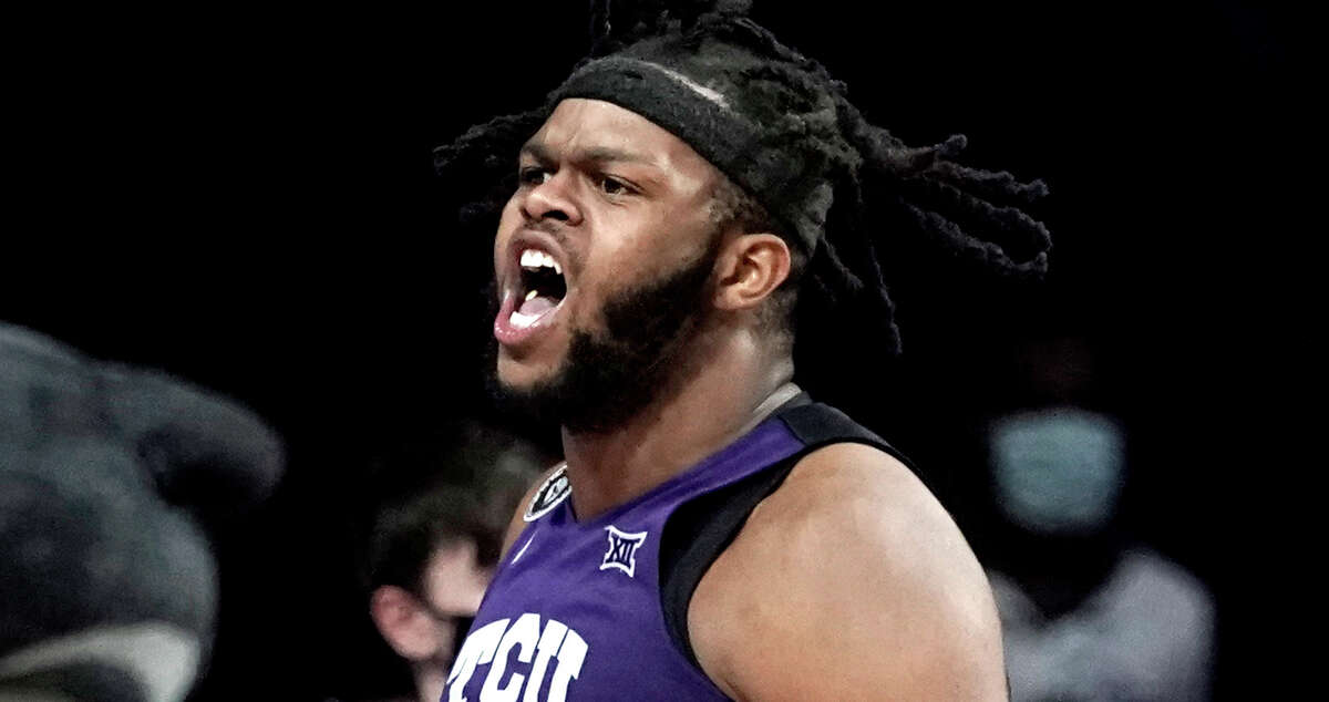 TCU center Eddie Lampkin celebrates after a basket during the second half of an NCAA college basketball game against Kansas State Wednesday, Jan. 12, 2022, in Manhattan, Kan. TCU won 60-57. (AP Photo/Charlie Riedel)