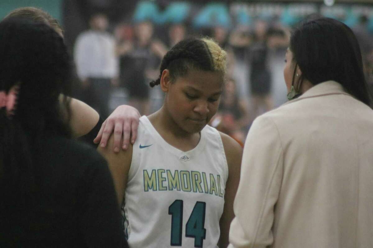 Sensing her 22-point effort isn't going to be enough, Memorial's Gwendlyn McGrew  listens to instructions during the team's final timeout.