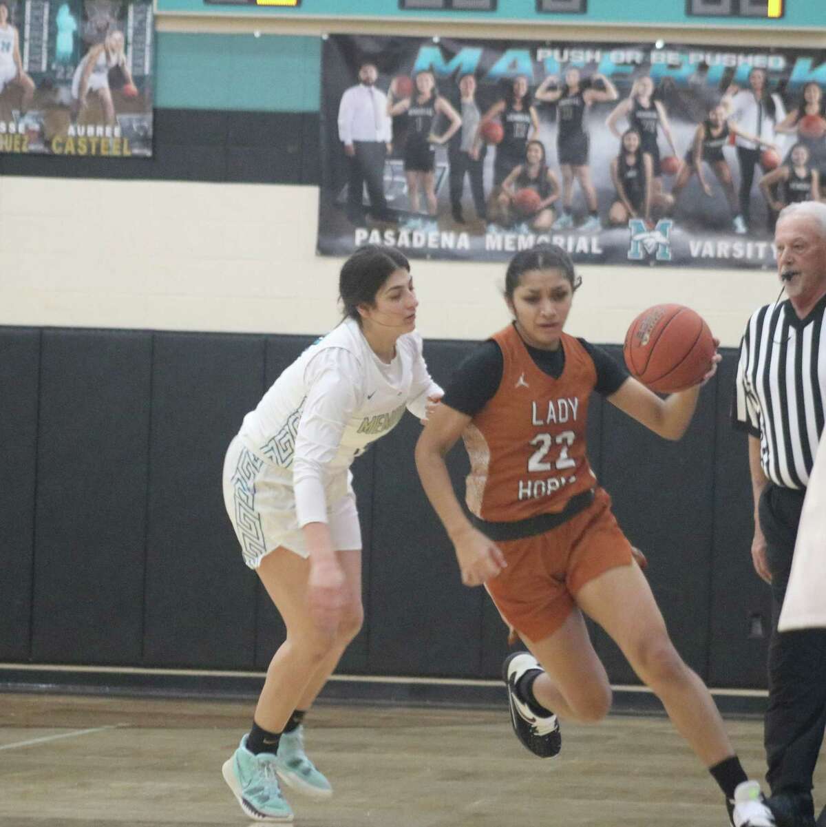 Victoria Rivera hustles the ball up court during first-half action. But she stepped out of bounds en route to doing so on this possession.