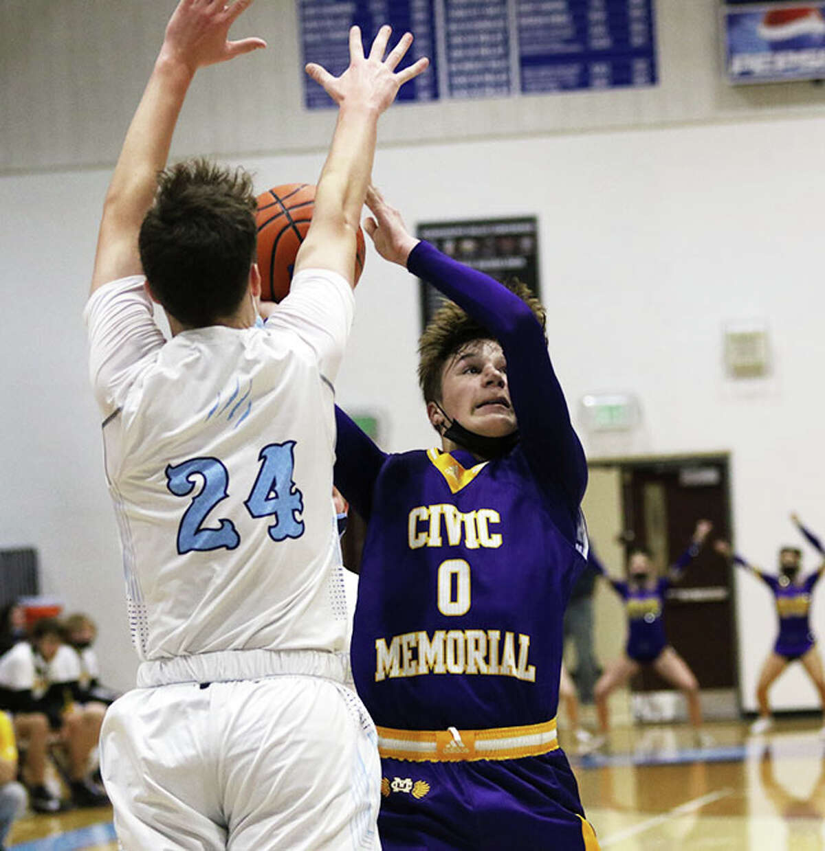 CM freshman Adam Ogden (0) shoots over Jersey's Ayden Kanallakan during a MVC game in Jerseyville on Dec. 3. On Saturday, Ogden hit six 3-pointers and scored a career-high 18 points in the Eagles win over Triad at the Litchfield Tourney.