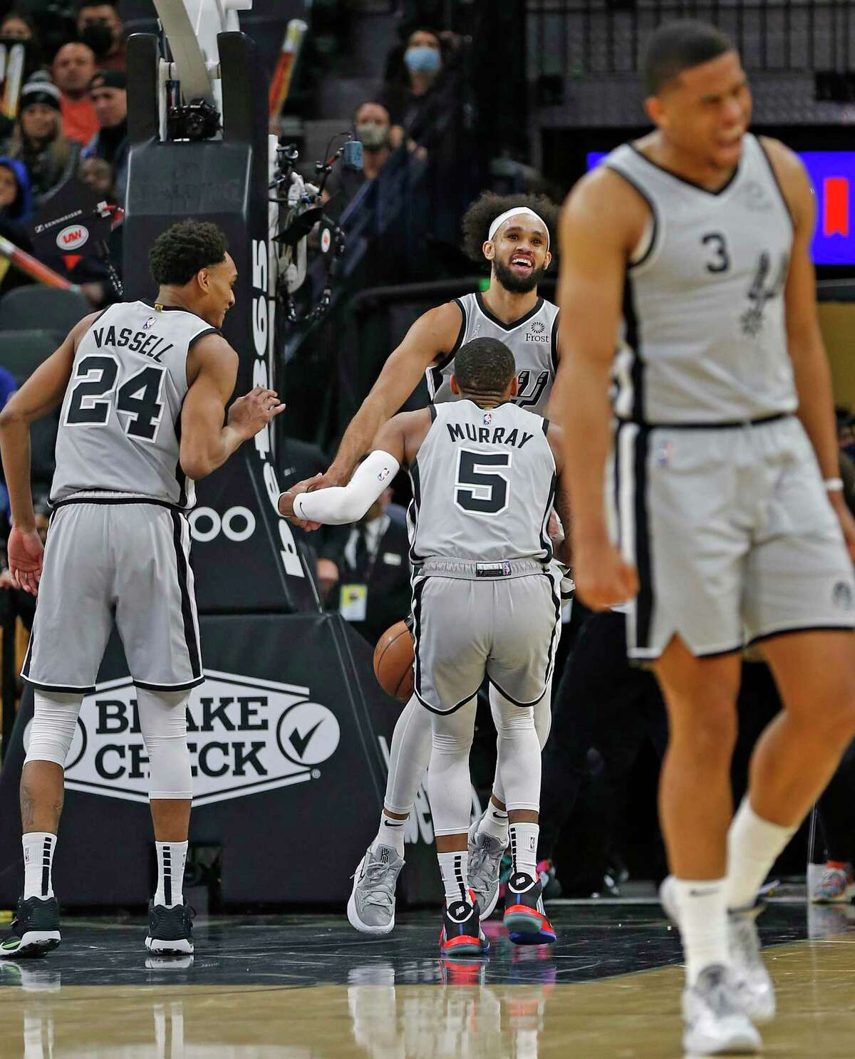 The Spurs have become quite used to congratulating and picking up Derrick White, back, after he has taken a charge.