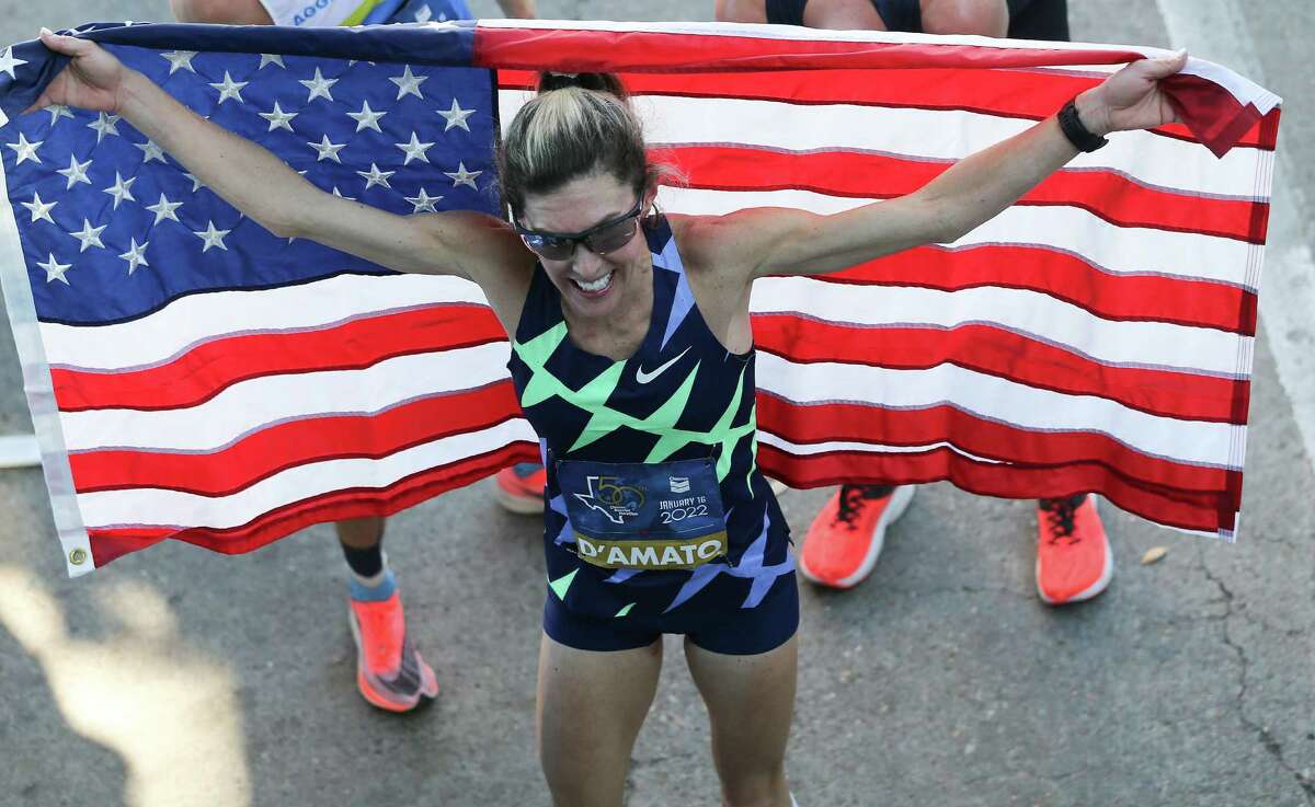 Keira D’Amato celebrates as she crosses the line for the Chevron Houston Marathon, breaking the Houston and the American Women’s record clocking in at 2:19:12 on Sunday, Jan. 16, 2022.