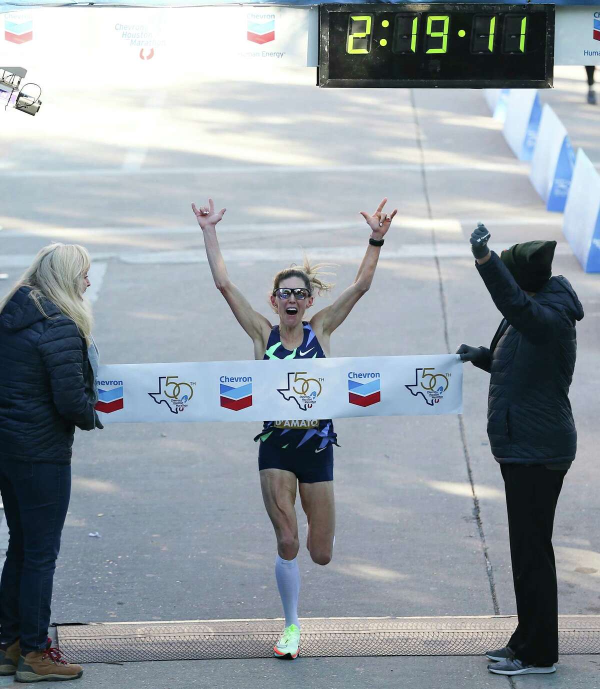 Keira D’Amato celebrates as she crosses the line for the Chevron Houston Marathon, breaking the Houston and the American Women’s record clocking in at 2:19:12 on Sunday, Jan. 16, 2022.