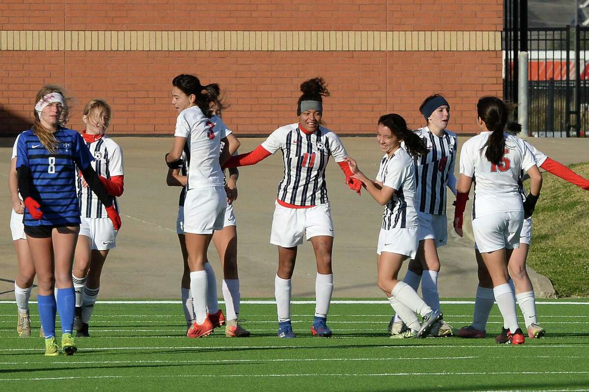 The Eagles celebrate a goal by Savanna Page (11) of Dawson during the second half of the Mustang Bracket championship match between the Katy Taylor Mustangs and the Dawson Eagles in the I-10 Shootout girl's soccer tournament on Saturday, January 15, 2022 at Rhodes Stadium, Katy, TX.