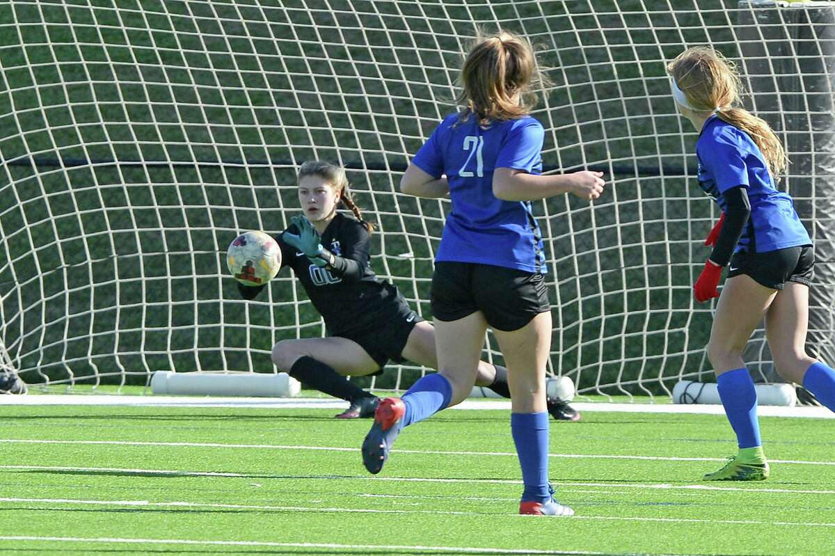 Goalkeeper Kaira Blancett (0) of Taylor makes a save during the first half of the Mustang Bracket championship match between the Katy Taylor Mustangs and the Dawson Eagles in the I-10 Shootout girl's soccer tournament on Saturday, January 15, 2022 at Rhodes Stadium, Katy, TX.