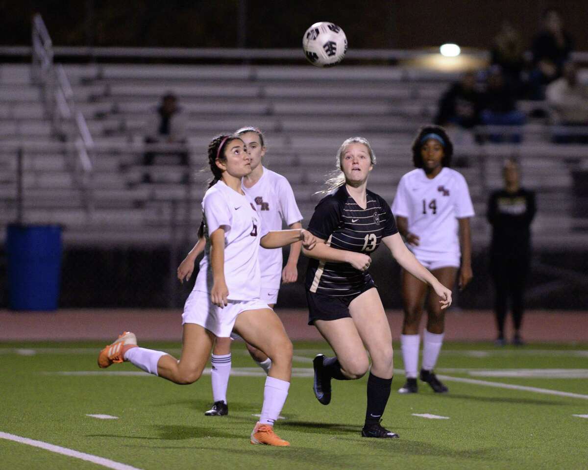 Marcela Martinez (6) of George Ranch and Abby Beck (13) of Foster chase a loose ball during the first half of a Cougar Bracket match in the I-10 Shootout between the Foster Falcons and the George Ranch Longhorns on Thursday, January 13, 2022 at Cinco Ranch HS, Katy, TX.