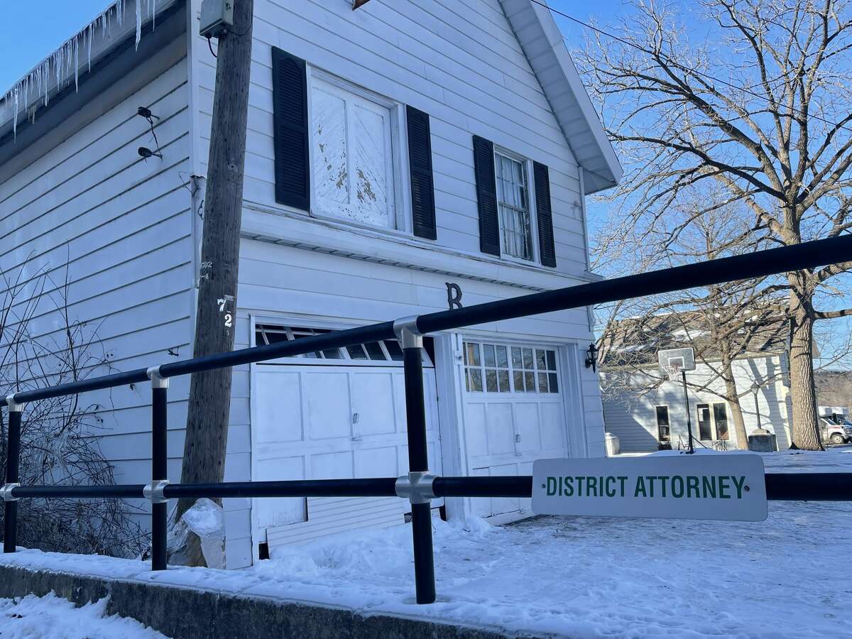 Parking spots for local officials are located adjacent to the Ehle-Barnett Funeral Home in Johnstown as of Jan. 16, 2022, including this space for the county district attorney. Two bodies were found in the garage.