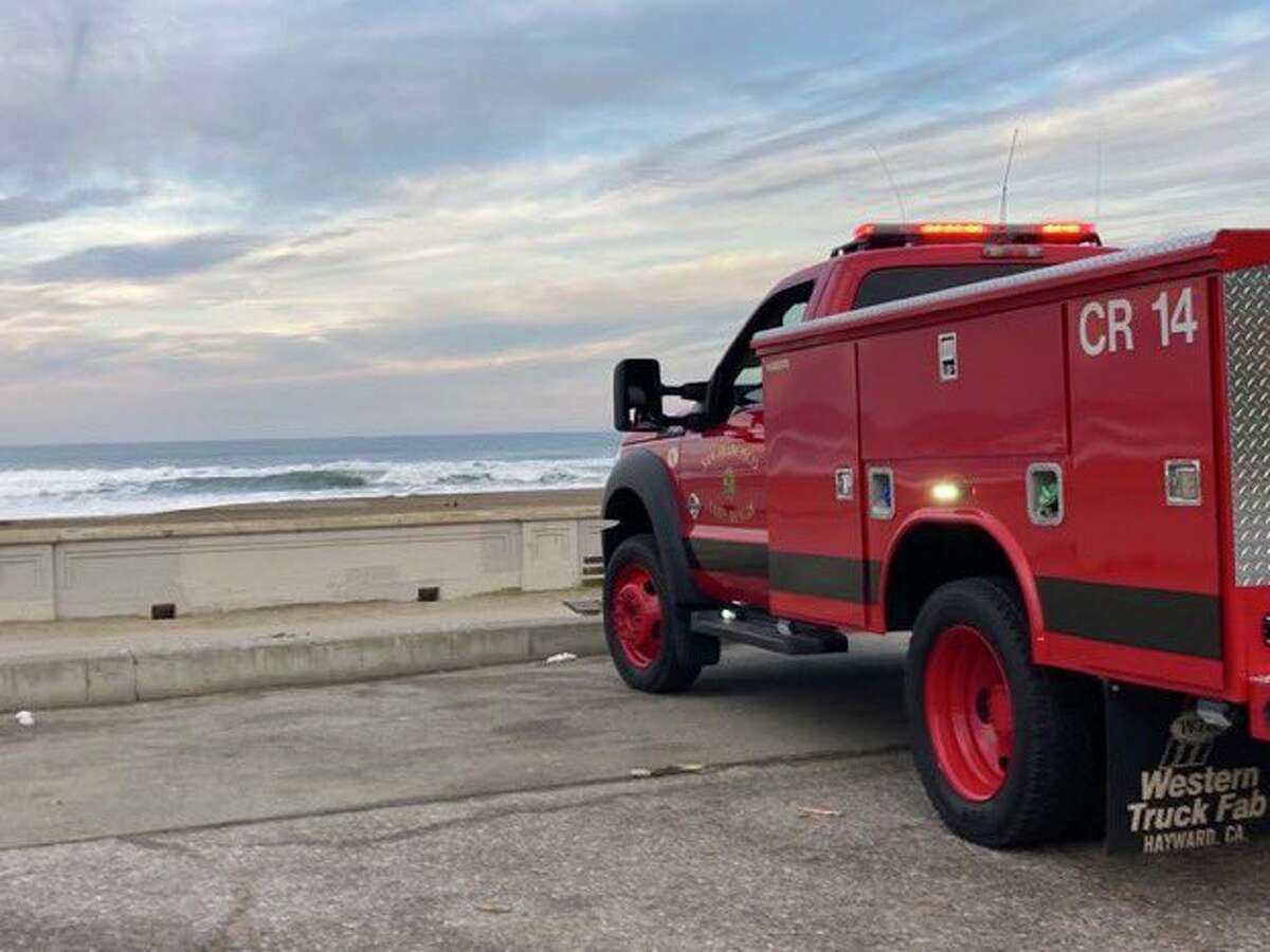 A rescue vehicle with the San Francisco Fire Department stationed at Ocean Beach.