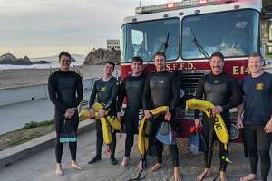 Some of the rescue swimmers dispatched by the San Francisco Fire Department at Ocean Beach. 